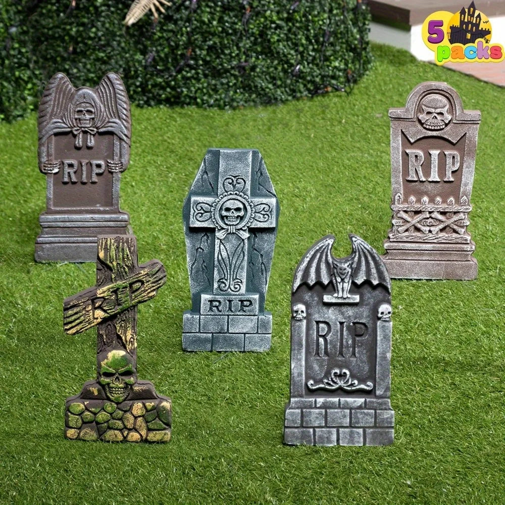 Foam RIP graveyard tombstones set up on a lawn for Halloween